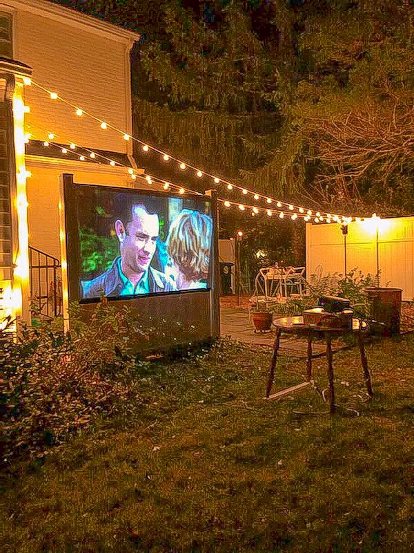 Scene from You've Got Mail on backyard movie screen