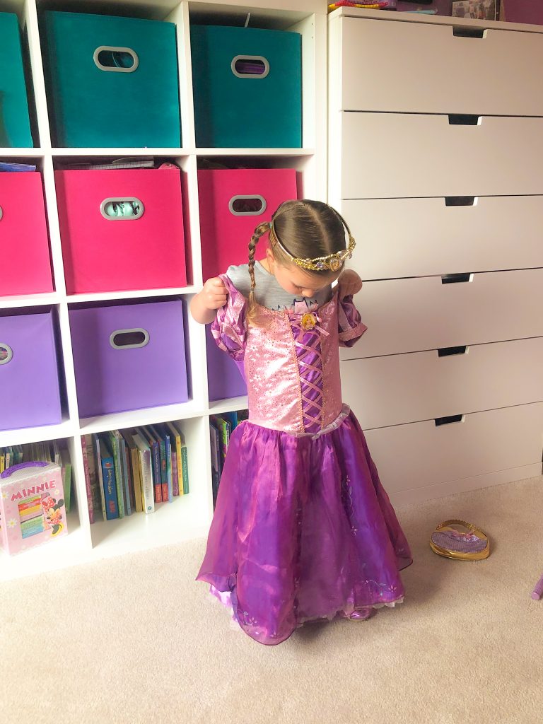 girl trying on a princess outfit