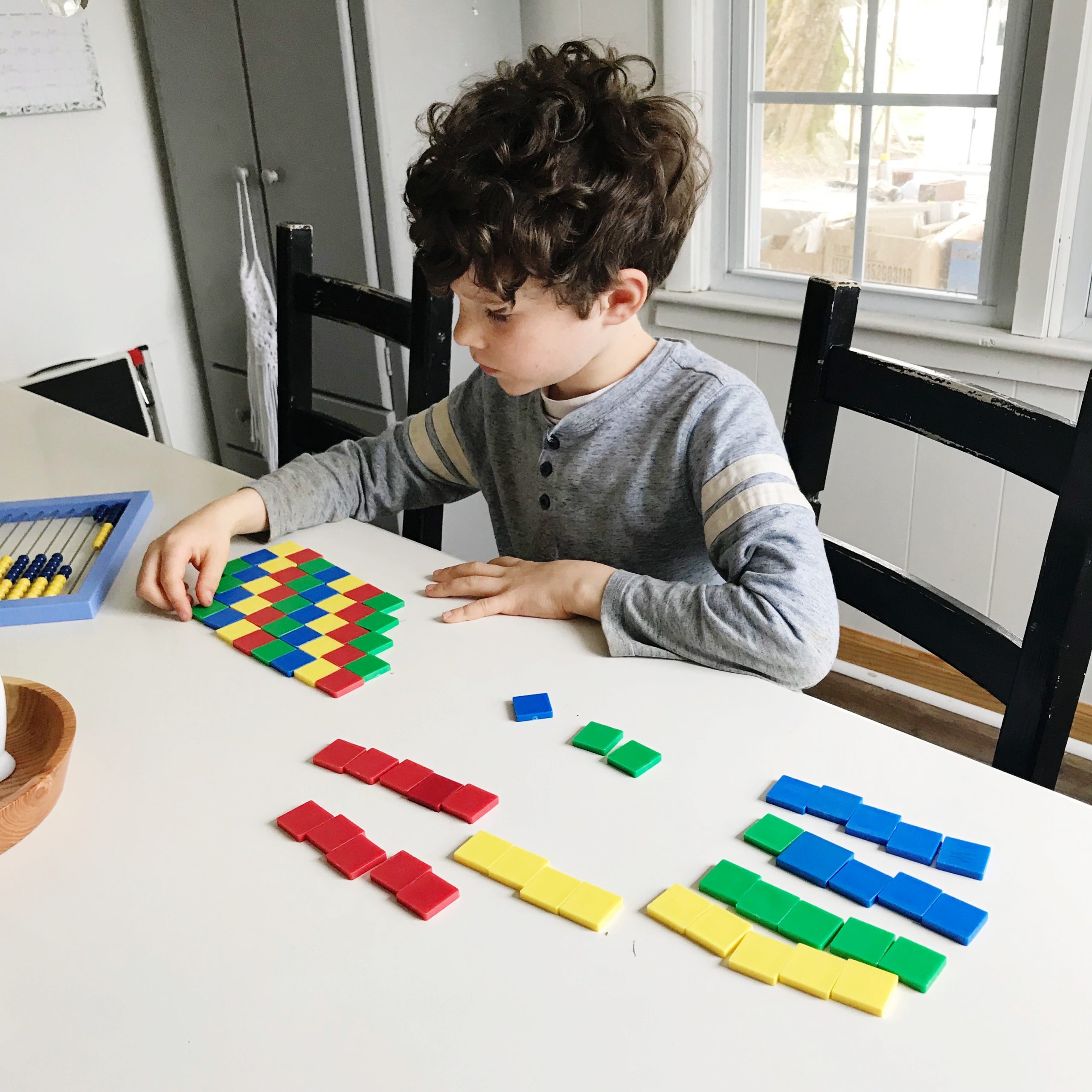 child playing with shapes at table