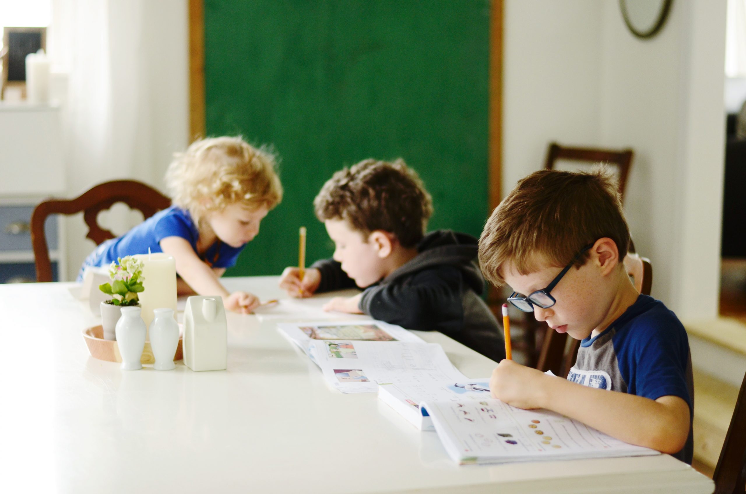 children doing schoolwork at a table