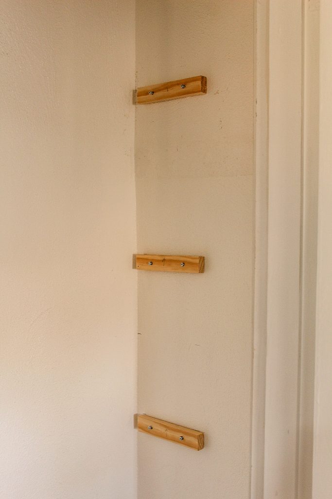 shelf supports mounted on closet wall